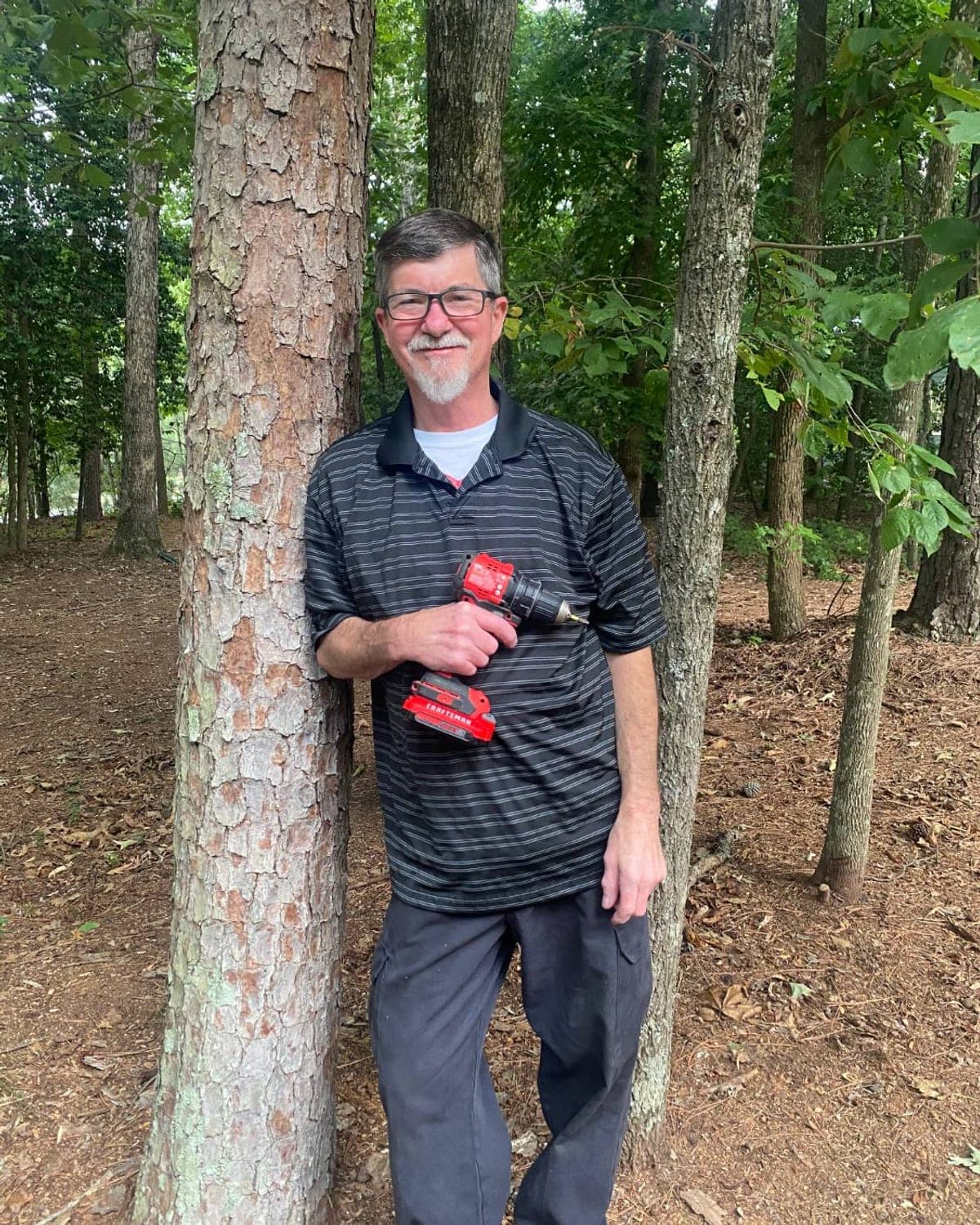 David Baney, owner of Forge Handyman Service, holding his drill