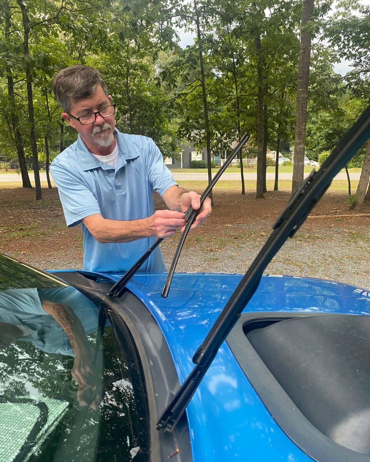 David Baney replacing windshield wiper blades
